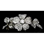 A late 19th Century gold and silvery coloured metal mounted all diamond flowerhead pattern brooch "