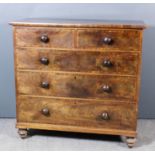 An early Victorian figured mahogany chest, fitted two short and three long drawers, on turned