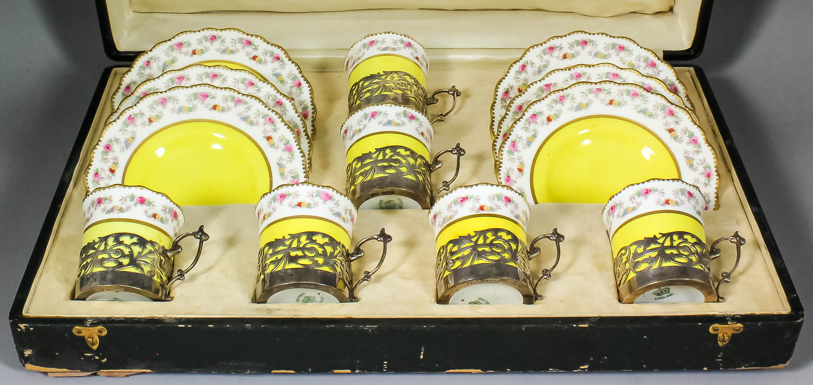 A set of six early 20th Century Aynsley bone china coffee cups and saucers, printed and painted with