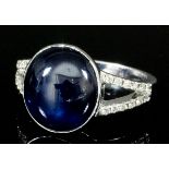 A modern 18ct white gold mounted star sapphire ring, set with cabochon cut star sapphire,