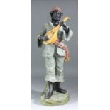 A late 19th/early 20th Century cold painted terracotta model of a standing male bearded figure