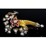 A 19th Century gold coloured metal mounted diamond and ruby posy pattern brooch, the wirework basket