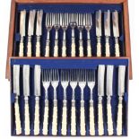 A set of eighteen Victorian plated and ivory handled fish knives and forks, contained in walnut