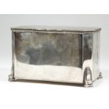 A George VI silver rectangular biscuit box with bead mounts and canted corners, on rectangular