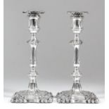 A pair of late Victorian silver pillar candlesticks of "mid 18th Century" design, the shaped and