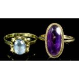 A 9ct gold mounted amethyst ring set with oval cut stone, 15mm x 12mm (size M+), and a 9ct gold