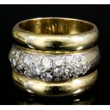 A modern 18ct yellow and white gold triple band ring, the central band pave set with small