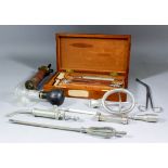 A collection of surgical/medical instruments and equipment, including - a doctor's case full of