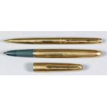 A Parker gilt metal cased fountain pen with engine turned ornament, and matching propelling