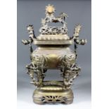 A Chinese cast brass rectangular two-handled koro, cover and stand, the pierced cover with dragon
