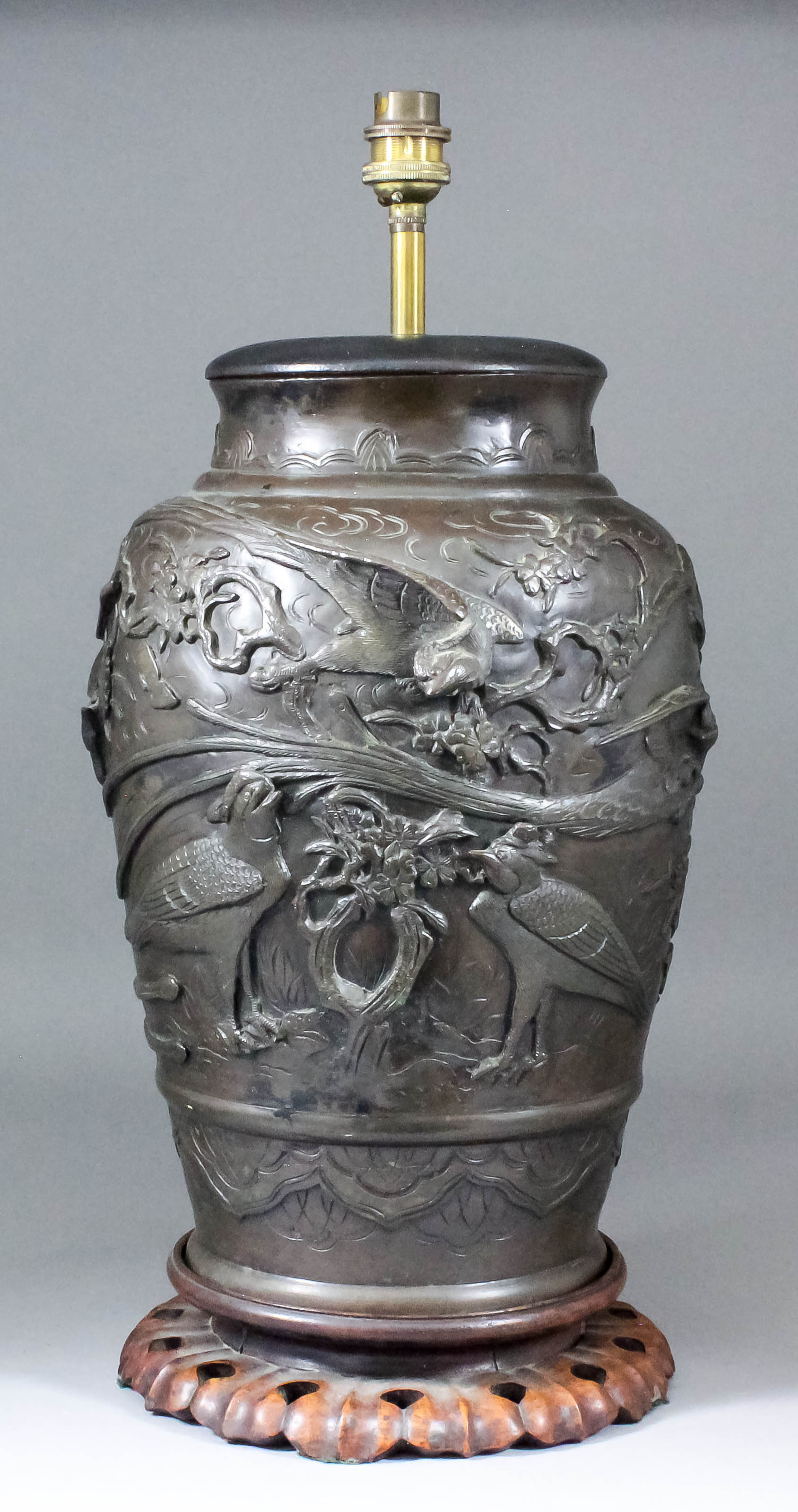 A Japanese brown patinated bronze vase, cast with exotic birds amongst rock work and blossoms, 13.