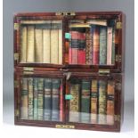 A 19th Century mahogany travelling library containing a collection of leather and cloth covered