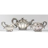 A George IV and William IV harlequin silver three-piece tea service, the circular squat lobed bodies