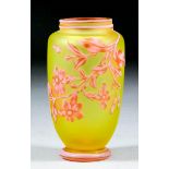 A late 19th Century three-layer cameo glass vase of baluster shape, the yellow ground cased in white