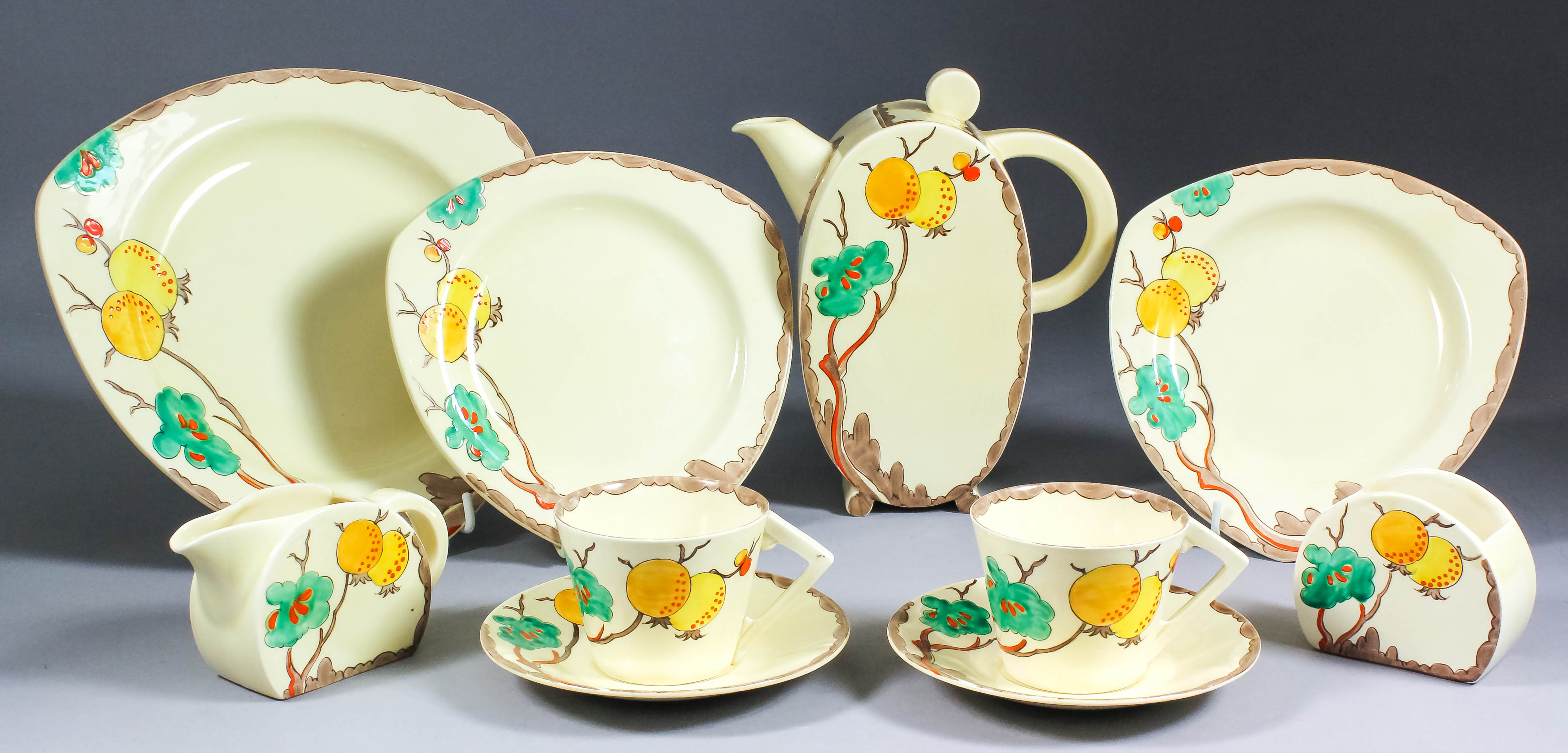 A Clarice Cliff pottery "Bonjour" shape tea for two set, comprising - teapot and lid, sugar bowl,