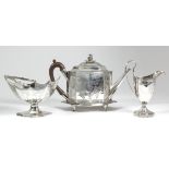 A George III silver octagonal four-piece tea service with reeded mounts, engraved with vacant shield