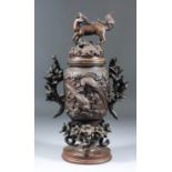 A Chinese brown patinated two-handled koro and cover with deer pattern finial, the body cast in bold