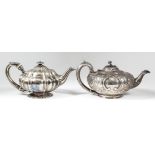 A George IV silver circular teapot of squat moulded form with circular reeded finial, C-scroll