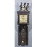 An unusual 19th Century "Black Oak" cased wall clock, the 18th Century 11ins brass square dial