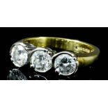 A modern 18ct gold mounted three stone diamond ring, set with three round brilliant cut diamonds