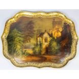 A Victorian papier mache tray of shaped outline, the centre painted with a view of Buckland Abbey,