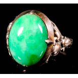 A 14ct gold mounted and jade ring, set with oval cabochon jade stone, approximately 15mm x 12mm (