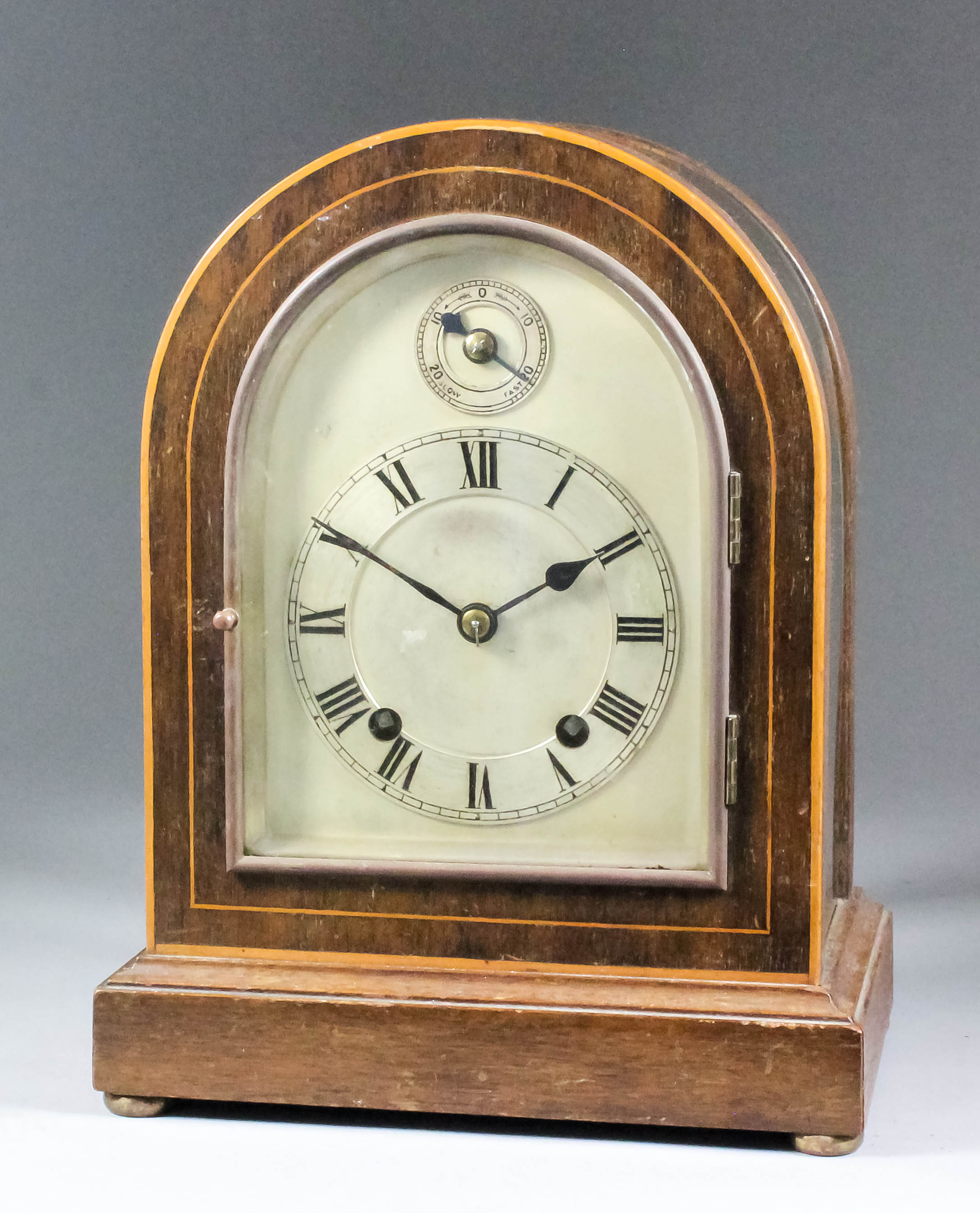 An early 20th Century German mahogany and bevelled glass cased mantel clock by Winterhalder &