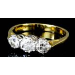 An 18ct gold mounted three stone diamond ring set with central stone (approximate weight .33ct)