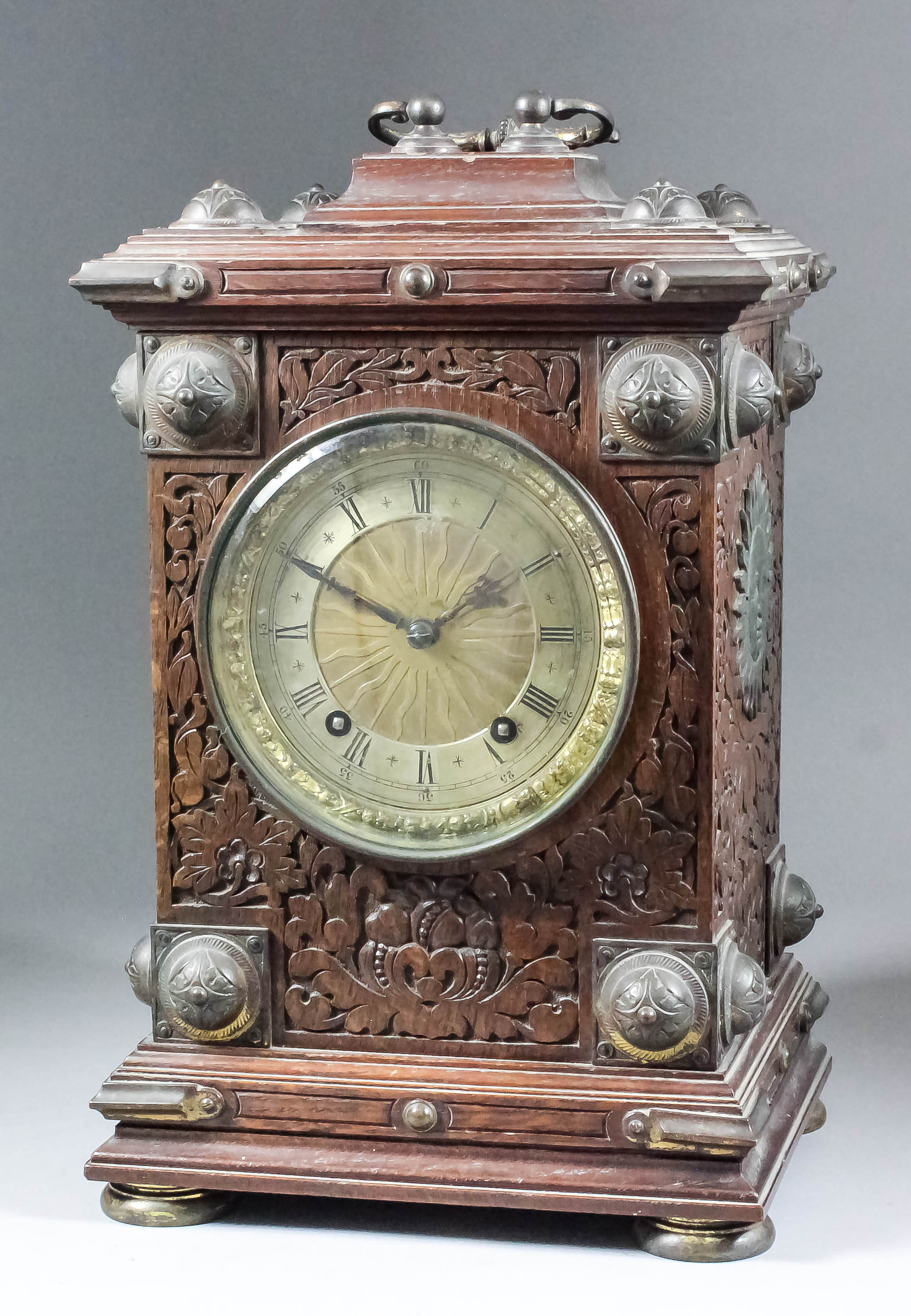 A late 19th Century German oak and brass mounted cased mantel clock by Winterhalder & Hofmeier,