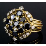 A gold coloured metal mounted sapphire and diamond cluster ring, set with nine old cut sapphires