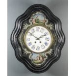 A late 19th Century French ebonised and mother-of-pearl wall clock of shaped and moulded outline,