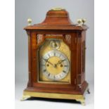 A late 19th Century mahogany and brass mounted mantel clock retailed by A. & H. Rowley of London,