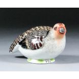 An 18th Century Meissen porcelain quail box and cover, 5.25ins x 2.875ins high (blue crossed