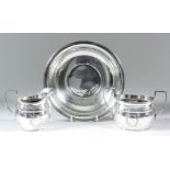 An Elizabeth II silver oval two-handled sugar basin with reeded mounts, engraved with a band of