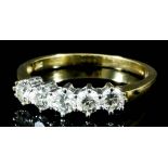 A modern 18ct gold mounted and diamond five stone ring, set with round brilliant cut diamonds (