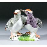 An 18th Century Meissen porcelain group of billing doves (Schwalben Schnabelnd) 4ins high (blue