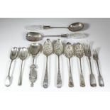 A pair of George III silver and silver gilt fruit spoons, the bowls and handles chased, embossed and