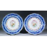 A pair of late 18th Century Chinese blue and white porcelain armorial plates of shaped outline,