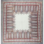 A paisley shawl 64ins x 61.5ins, two pairs of embroidered curtains, and a lace curtain