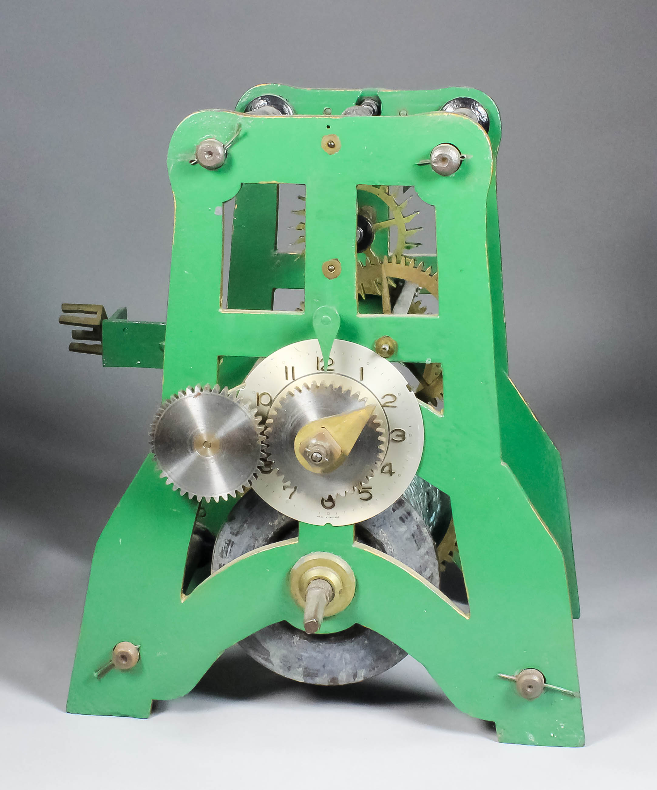 A small 19th Century turret clock movement with green japanned and gilt decorated iron framed