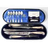 A Victorian horn and silver mounted five-piece carving set with reeded scroll terminals to