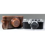 A Leica IIIc camera No. 286204, with 50mm lens No. 349413, in original leather case