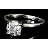 A modern 18ct white gold mounted solitaire diamond ring, set with a round brilliant cut diamond (