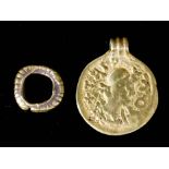 An early Medieval gold Bracteate with triple reeded suspension loop, the obverse in relief with a