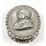An early 20th Century Dutch silver oval snuff box with crimped rim, the lid embossed with the head
