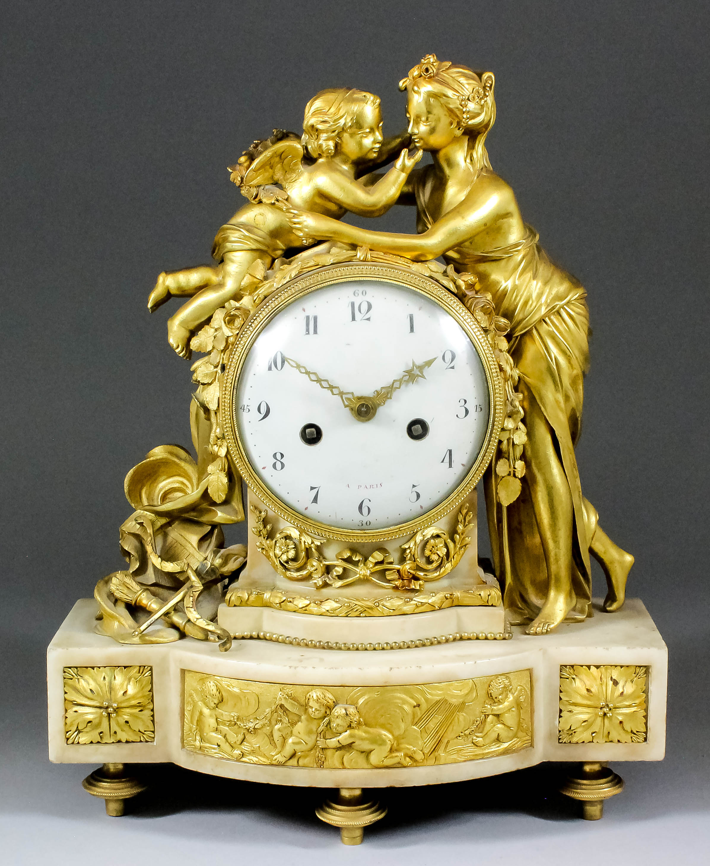 A 19th Century French ormolu and white marble cased mantel clock, the 4.5ins diameter domed white