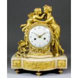 A 19th Century French ormolu and white marble cased mantel clock, the 4.5ins diameter domed white