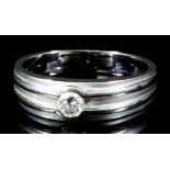 A modern 18ct white gold mounted solitaire diamond ring, set with a round brilliant cut diamond (