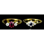 A modern 18ct gold mounted ruby and diamond three stone ring, set with central oval ruby (