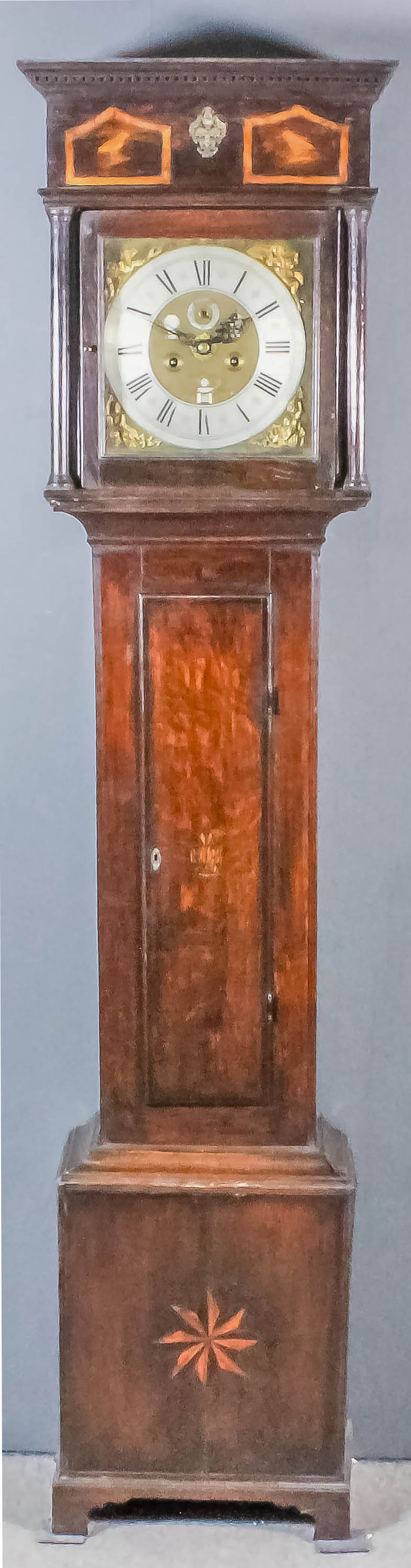 An 18th Century Dutch oak longcase clock by Pieter Klock of Amsterdam, the 12.25ins square brass